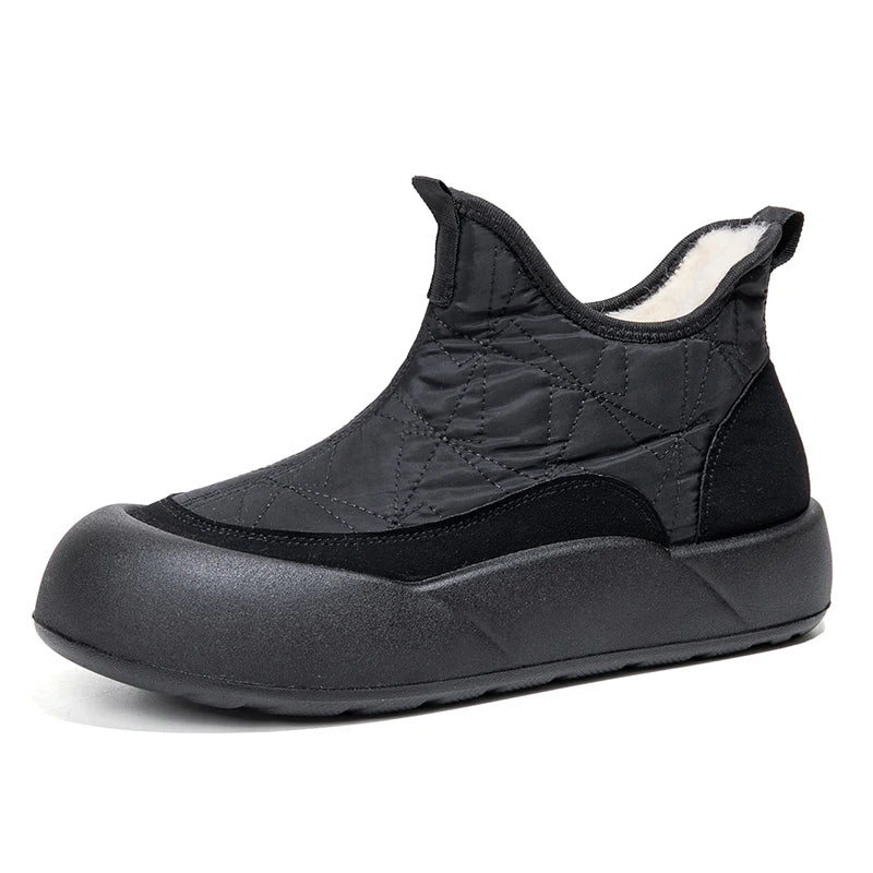 Black slip-on shoe with quilted design on a white background
