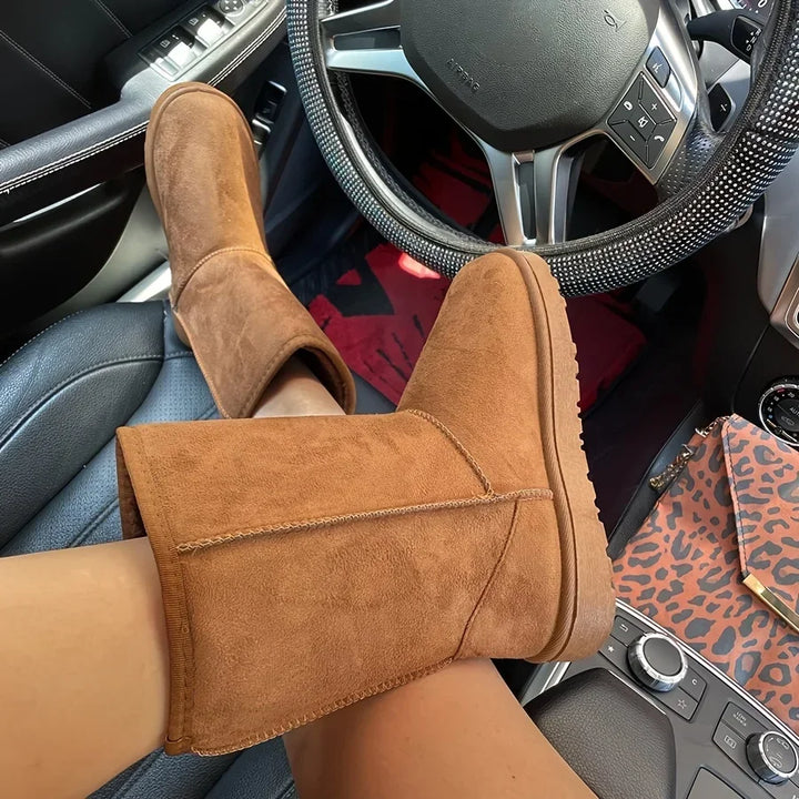Tan corduroy mid-calf platform snow boots with stitched upper and plush cuff