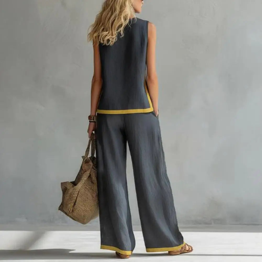Dark gray back view sleeveless vest and wide-leg pants with gold trim