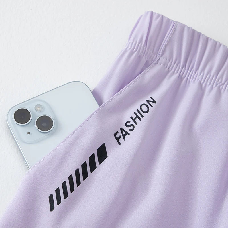 Lavender pants: elastic waistband and printed 'FASHION' stripe