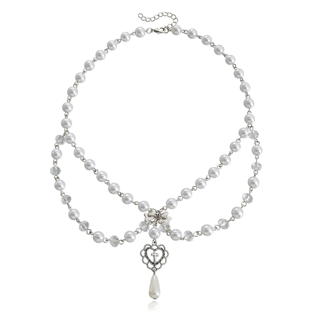 Ivory pearl multi-strand necklace with heart pendant and teardrop drop, silver-tone chain
