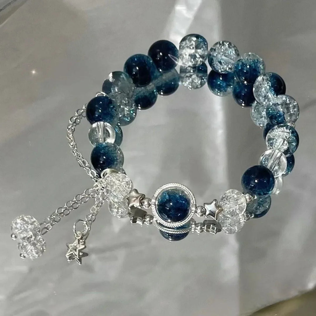 Women's dark-blue and clear crystal beaded elastic bracelet with star charms and dangling chain