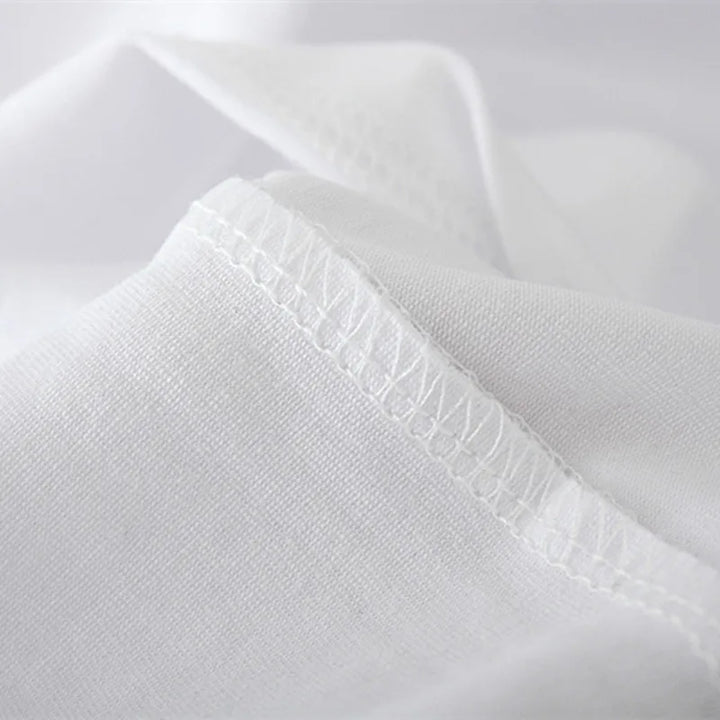 White tee fabric close-up showing stitched neckline detail