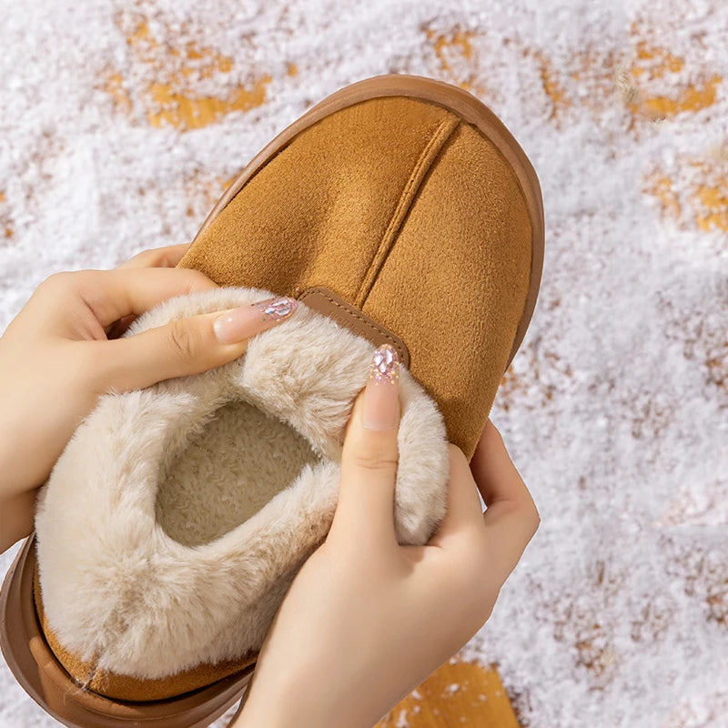 Women’s tan winter suede boots with plush sherpa lining and hook-and-loop strap detail