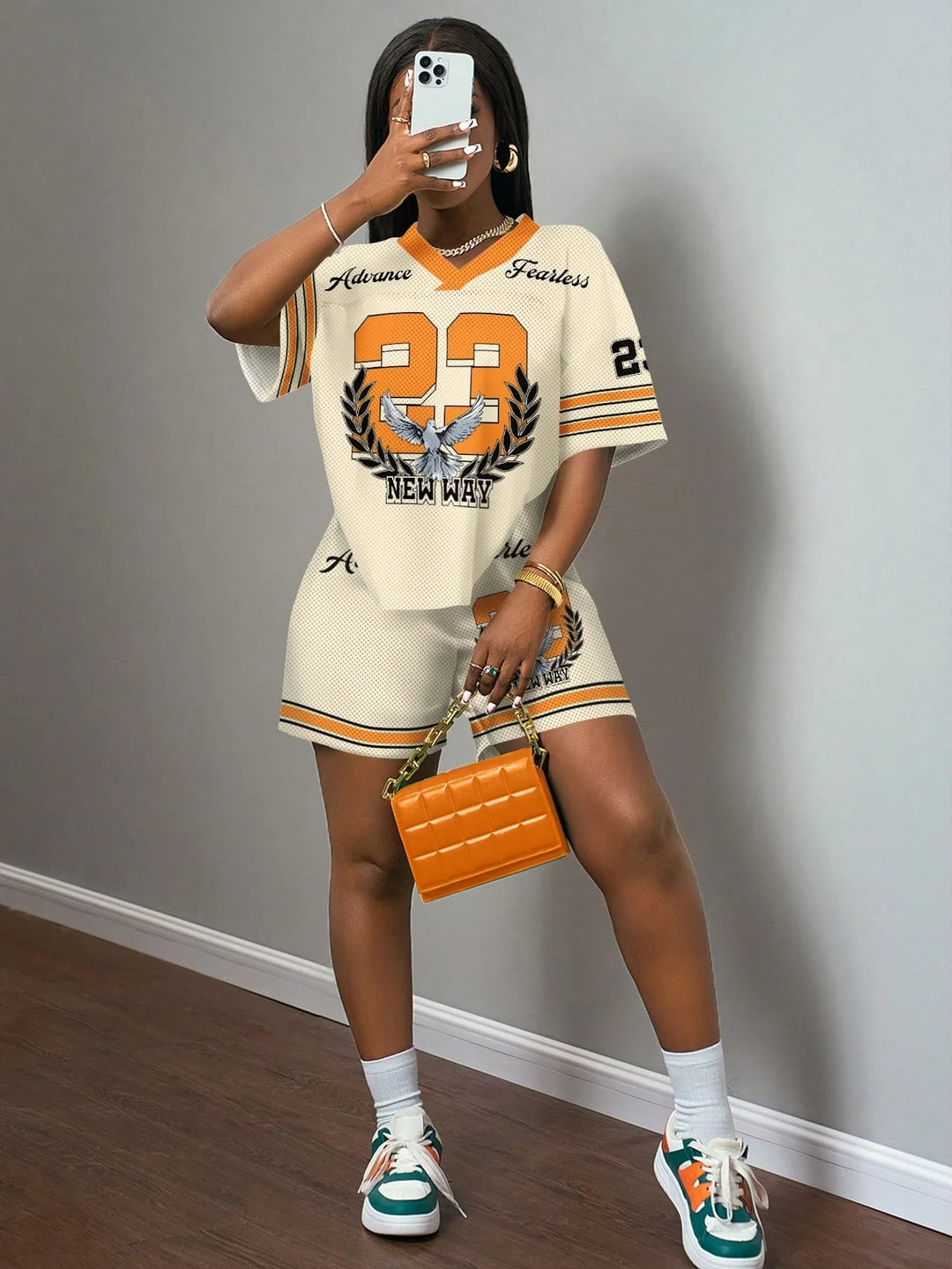 Jersey tee and shorts set, cream with orange trim and number graphic, matching elastic-waist shorts