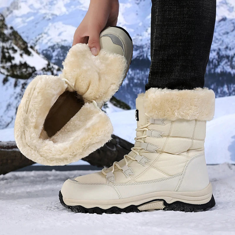 Women’s winter snow boots in light beige, plush-lined collar and lace-up front.