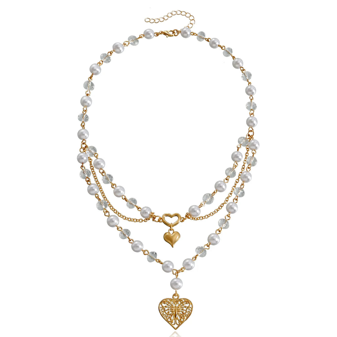 Ivory pearl and gold-tone multi-strand necklace with heart charm and dangling teardrop