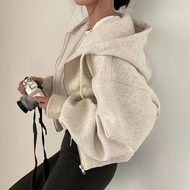 Light gray zip-front hooded sweatshirt with pouch pocket and front zipper
