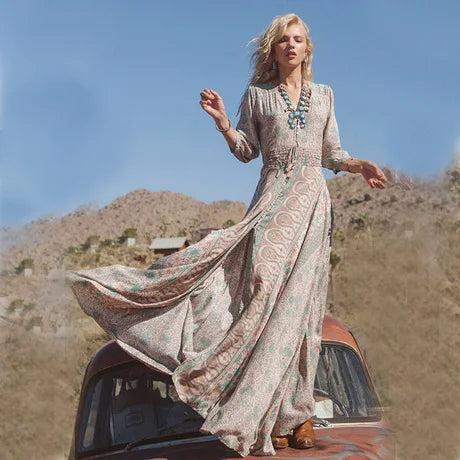 Long maxi dress with V-neck, three-quarter sleeves, paisley floral print, flowing skirt