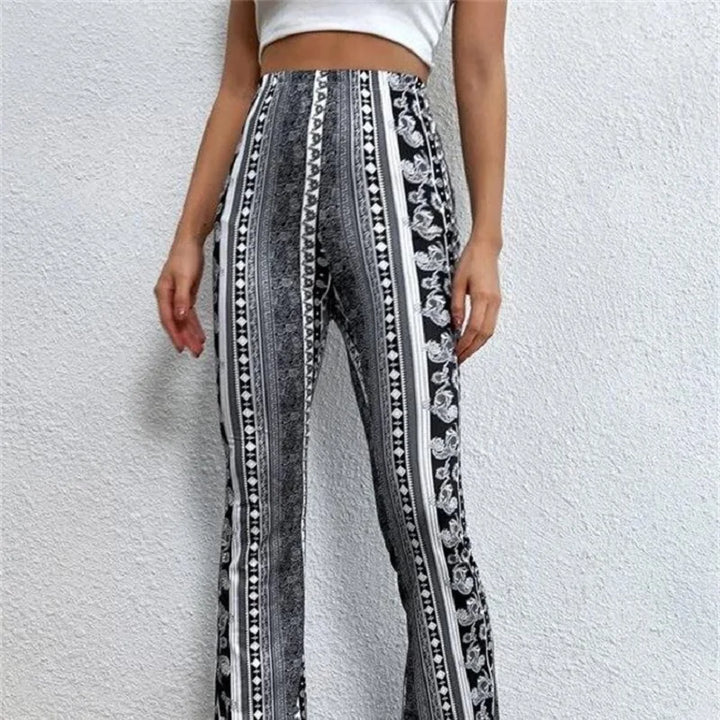 Low-waist flare pants with black and white vertical stripe ornate print and flared legs