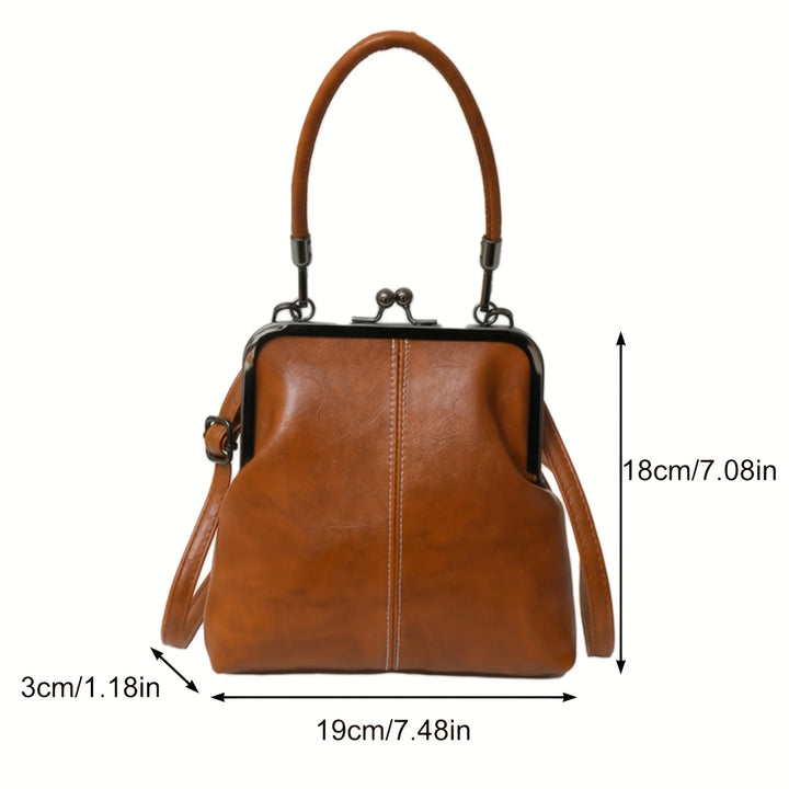 Brown leather handbag with dimensions indicated on a white background