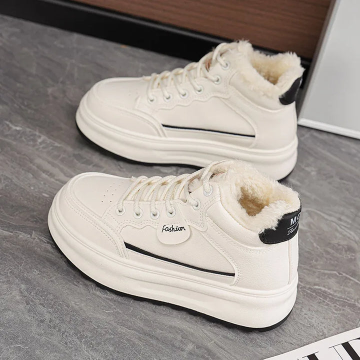 White lace-up platform sneakers with plush fur lining and black heel detail