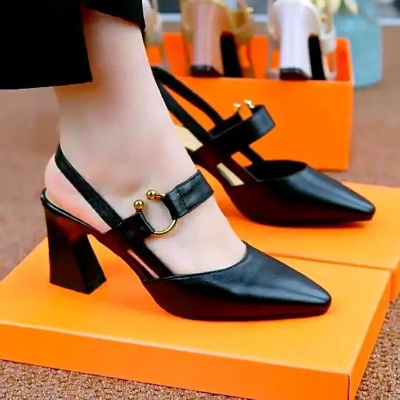 Black leather high-heel open-toe pumps, ankle strap with small gold buckles