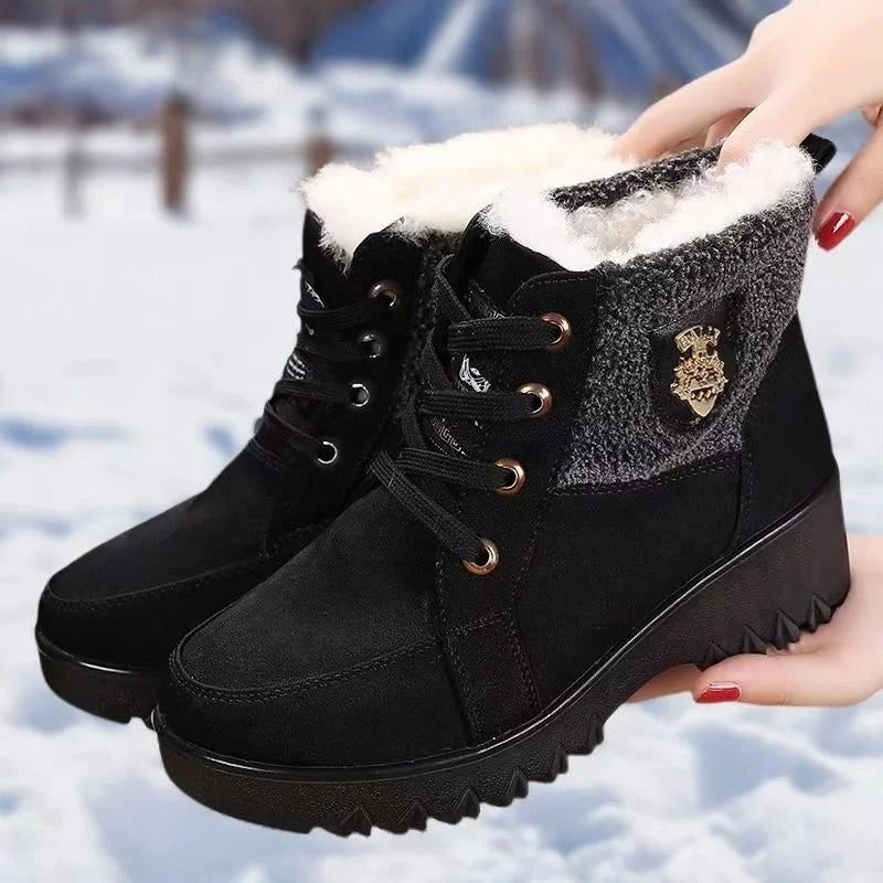 Women’s black lace-up winter boots with faux-fur lining and gold-toned lace hardware