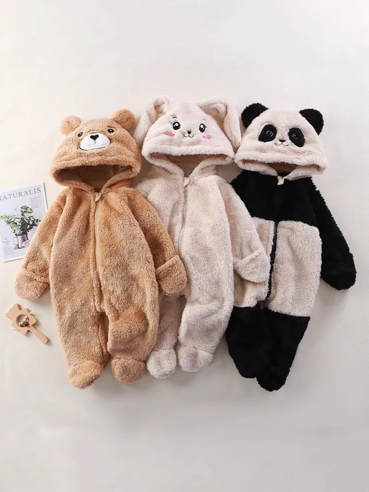 Three baby onesies with animal faces on a white background