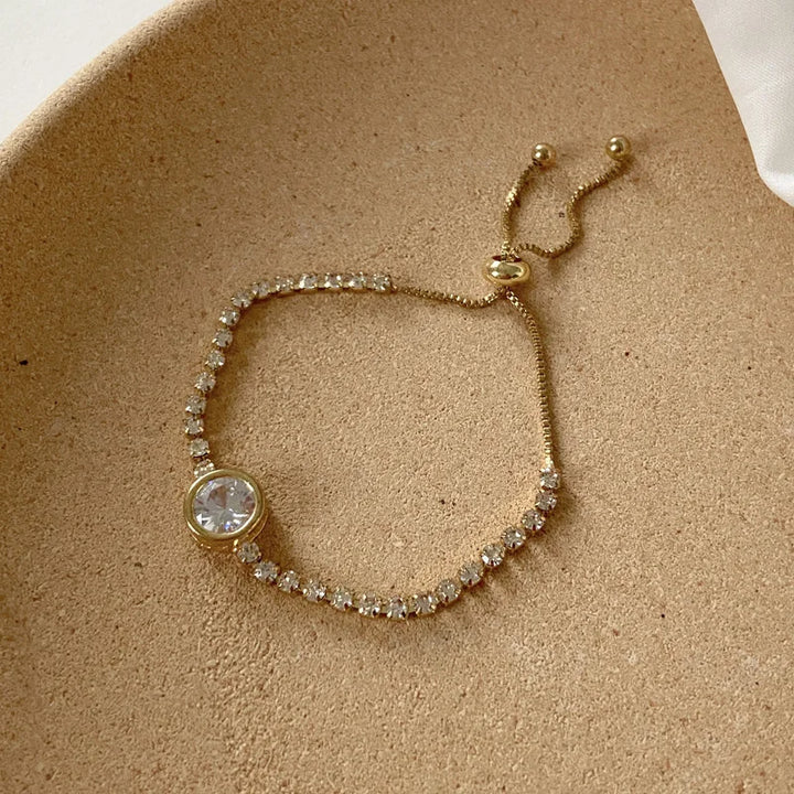 Silver-tone bracelet with round bezel clear stone and small pavé accents