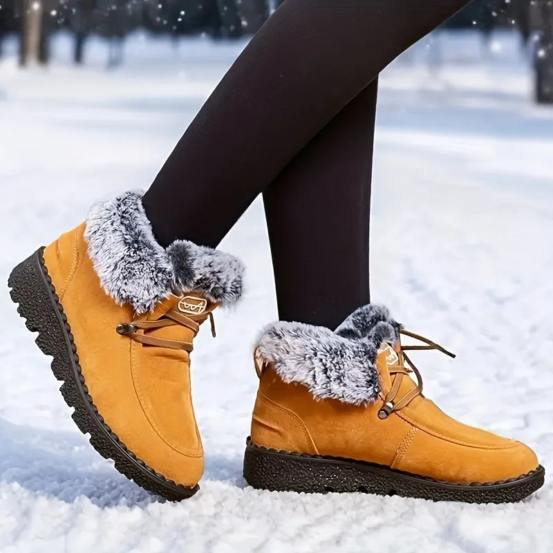 Women's yellow lace-up winter snow boots with faux-fur cuffs and lug sole