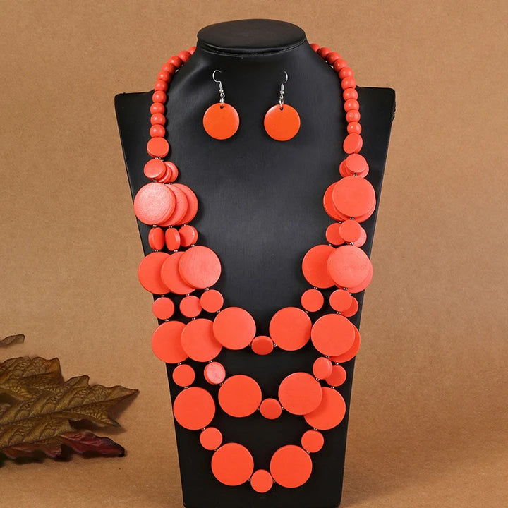 Coral/orange multilayer disc beaded necklace set with matching drop earrings