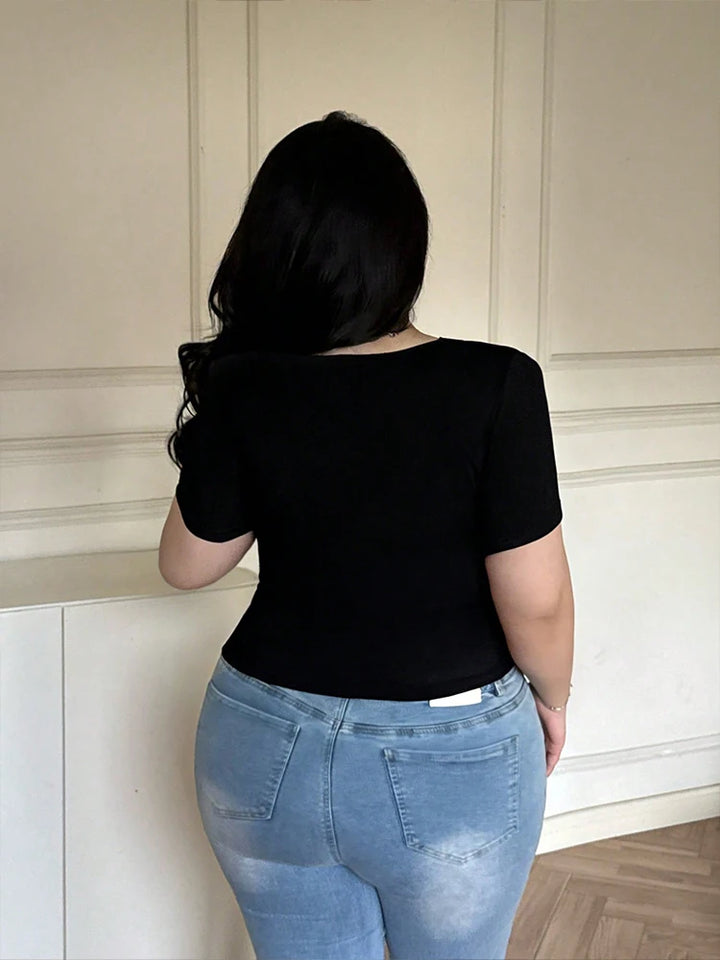 Black short-sleeve top, viewed from the back