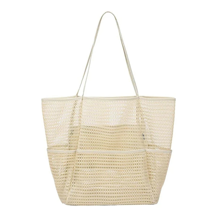 Foldable mesh travel tote in beige, open top with two long shoulder straps
