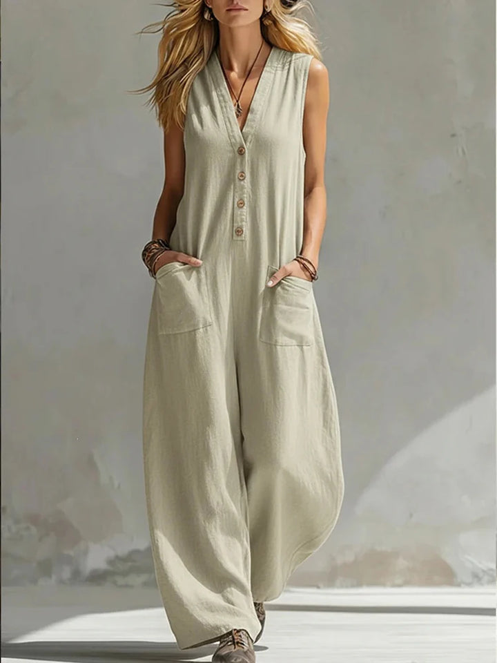 Women's light beige sleeveless V-neck button jumpsuit with patch pockets, wide-leg