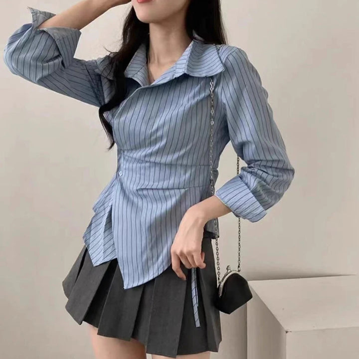 Light blue striped slim-fit blouse with pointed collar and long sleeves