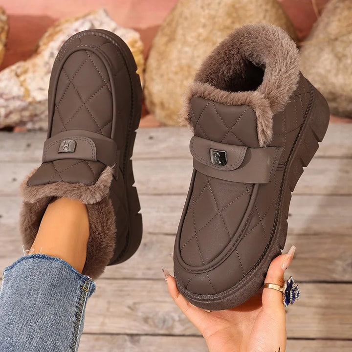 Brown quilted ankle boots with faux fur lining and hook-loop strap closures