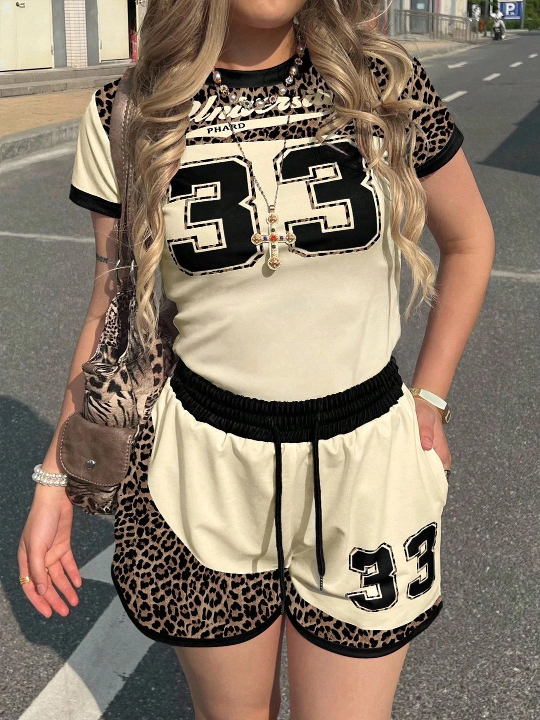 Two-piece jersey tee and shorts set, cream with leopard print, black numbers 33