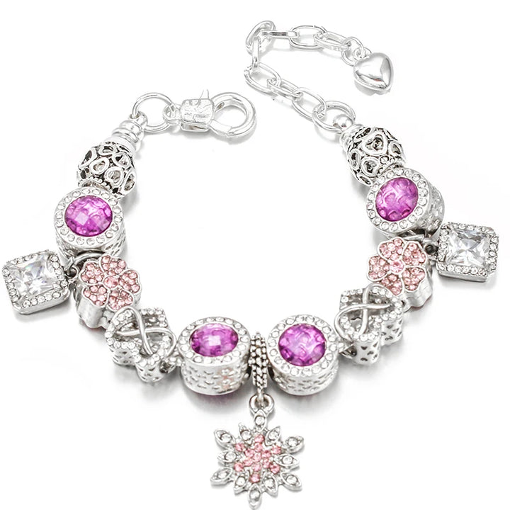 Silver charm bracelet with purple faceted beads, pink flower charm dangle, and heart accents