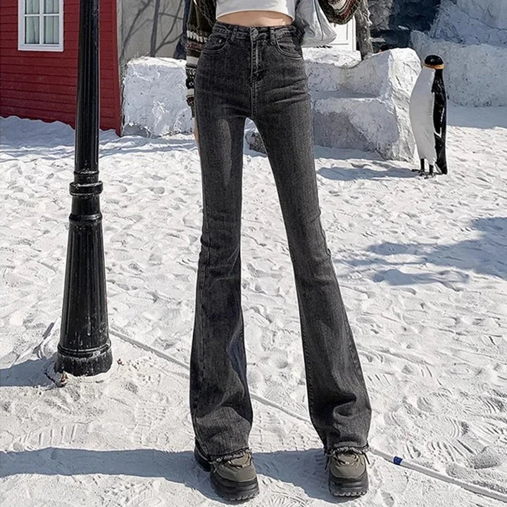 High-rise flare denim jeans, dark grey/black wash, fitted through thigh to flare