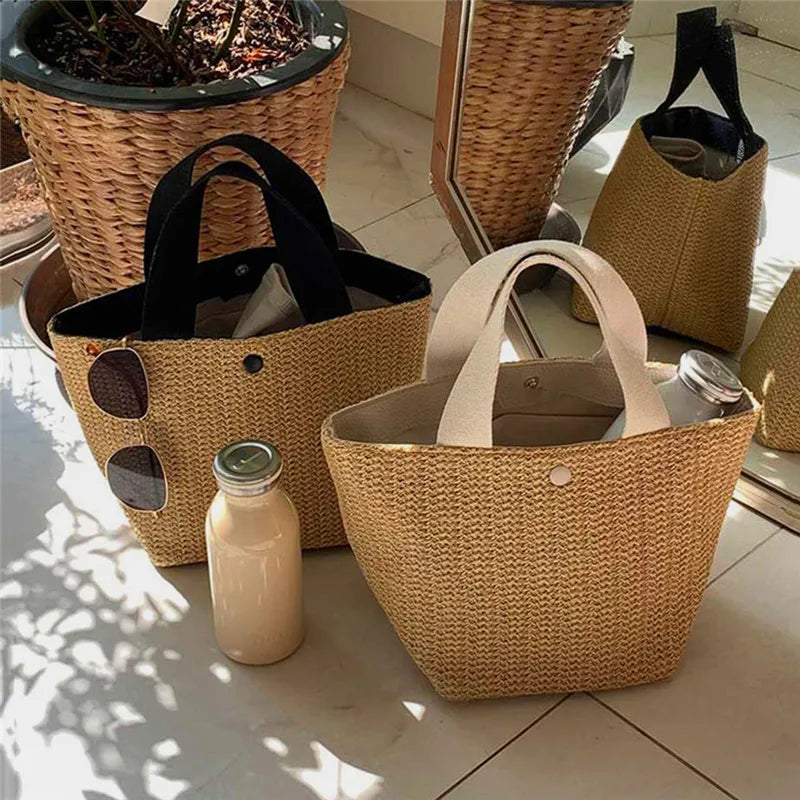 Set of woven straw bucket handbags, beige body with black handle and small button pocket