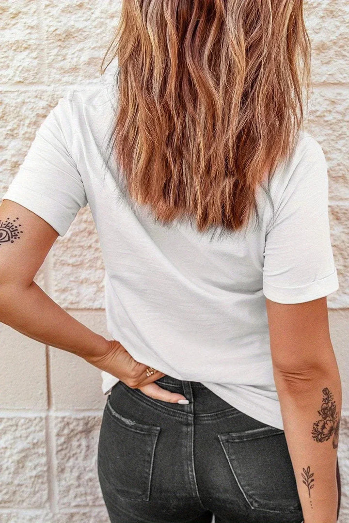Plus size white graphic tee worn by model, crew neck and short sleeves