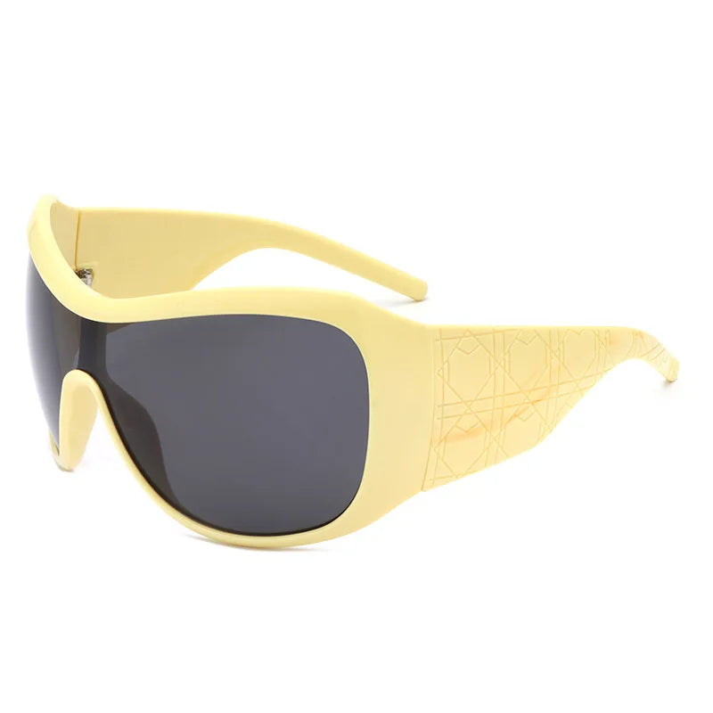 Yellow sunglasses with dark lenses on a white background