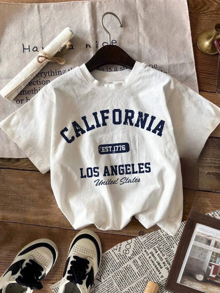 White plus size graphic tee with CALIFORNIA Los Angeles EST 1776 United States