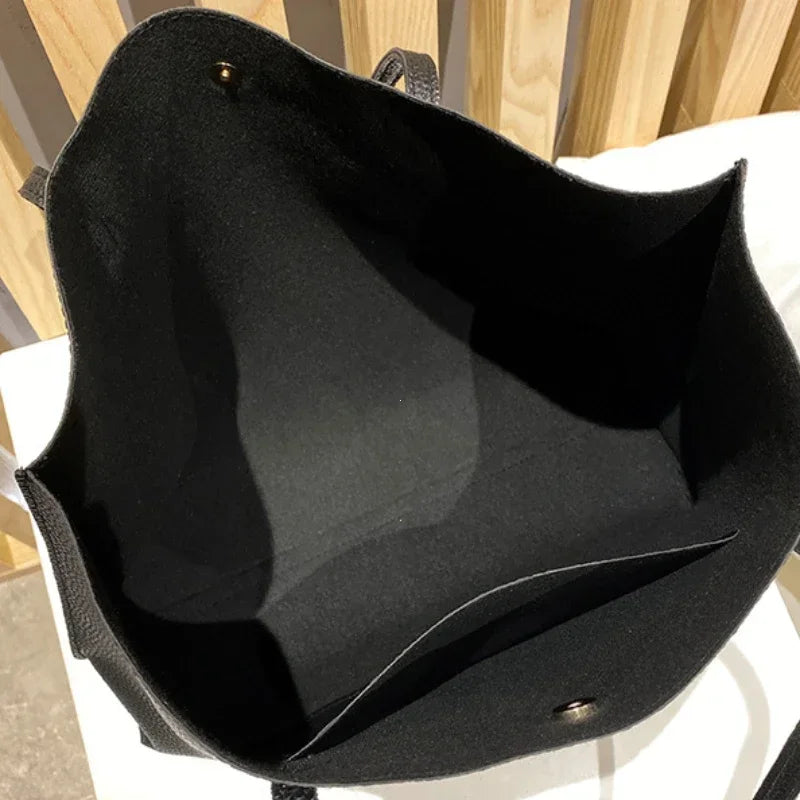 Black bag with a wooden background
