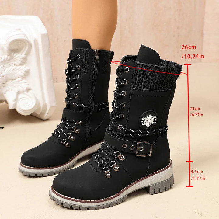 Women’s winter boots in black with lace-up design, side knit panel, and rugged sole.