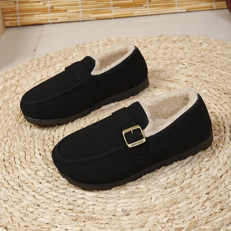 Black slip-on loafer with gold buckle and short plush lining