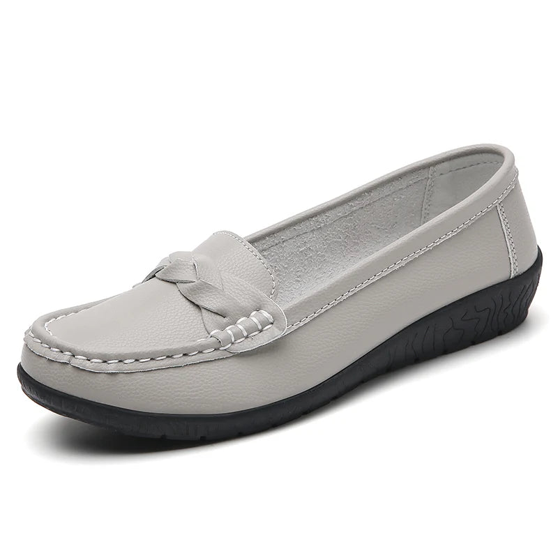 Gray loafer shoe on a white background