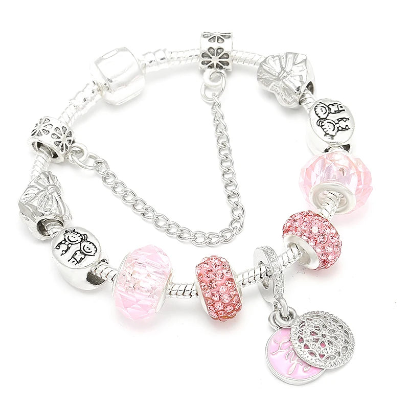 Silver-tone bracelet with pink crystal beads and heart pendant charm