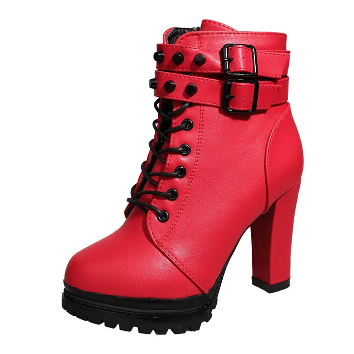 Red high-heeled boot with black laces and buckle on a white background