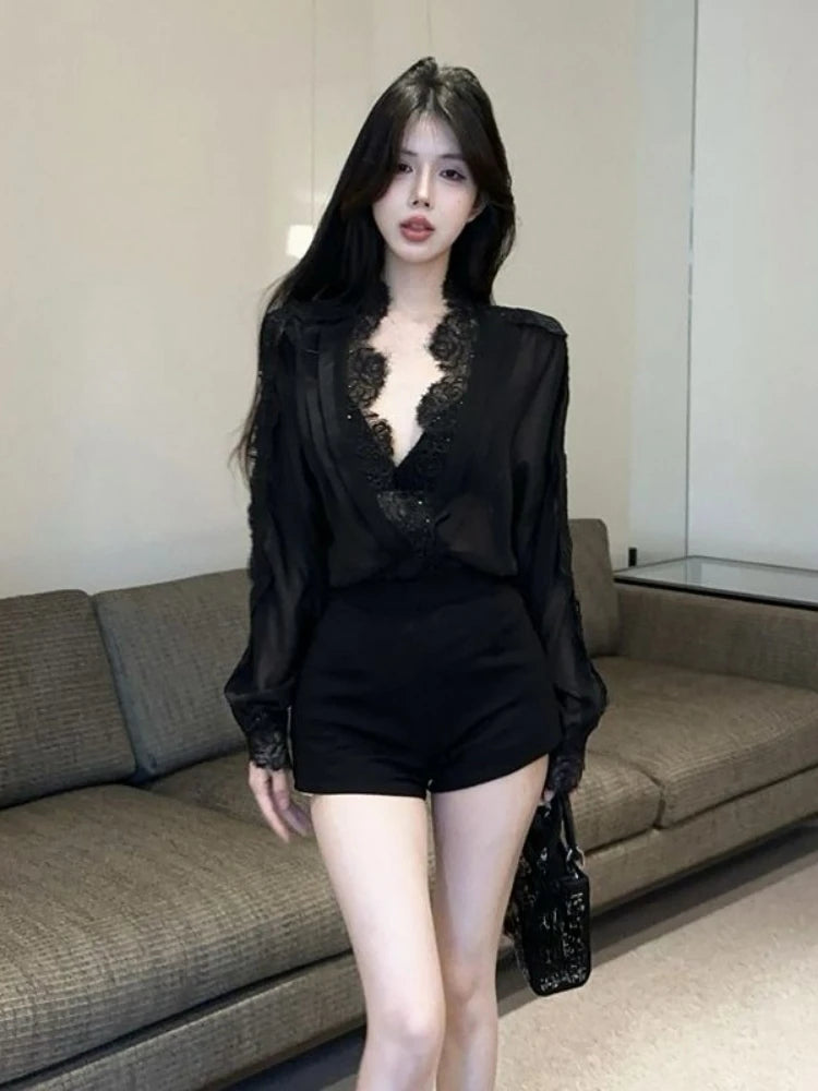 Woman wearing a black lace top and shorts in an indoor setting