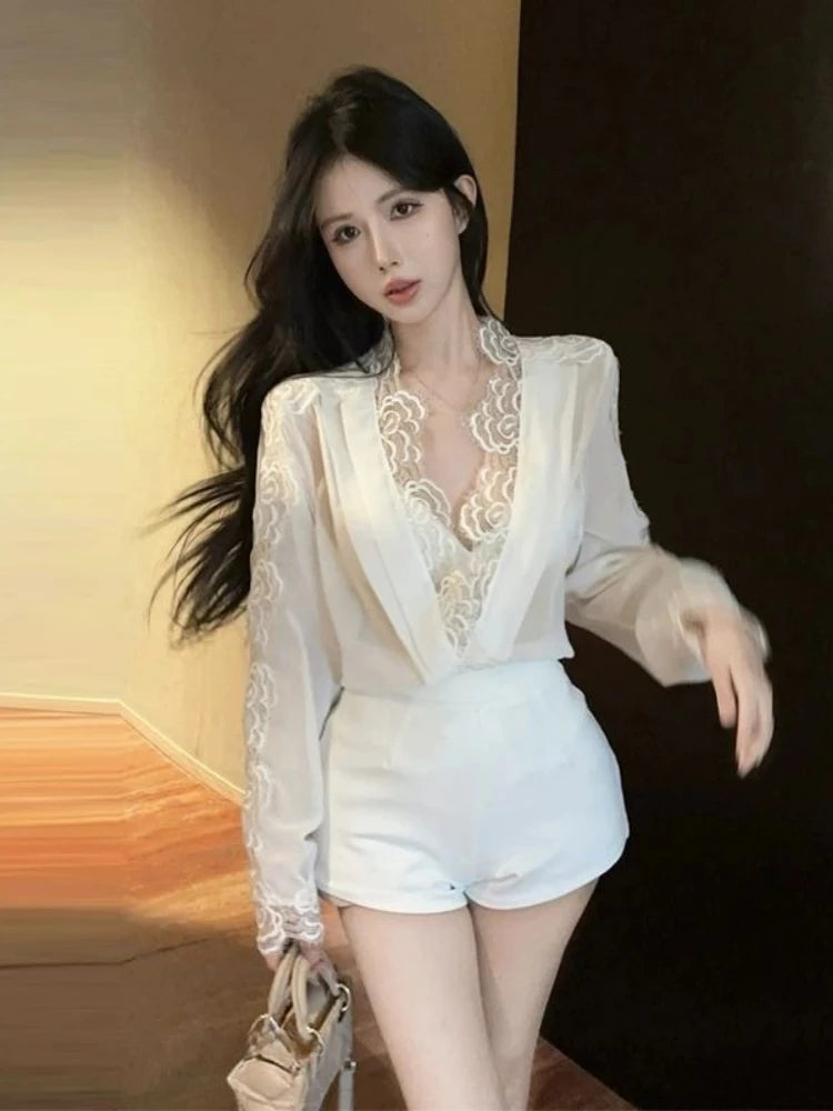 Woman wearing a white lace top and shorts with a blurred background