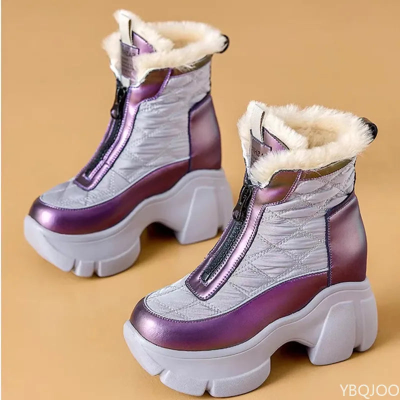 Purple and white winter boots with quilted design on a beige background