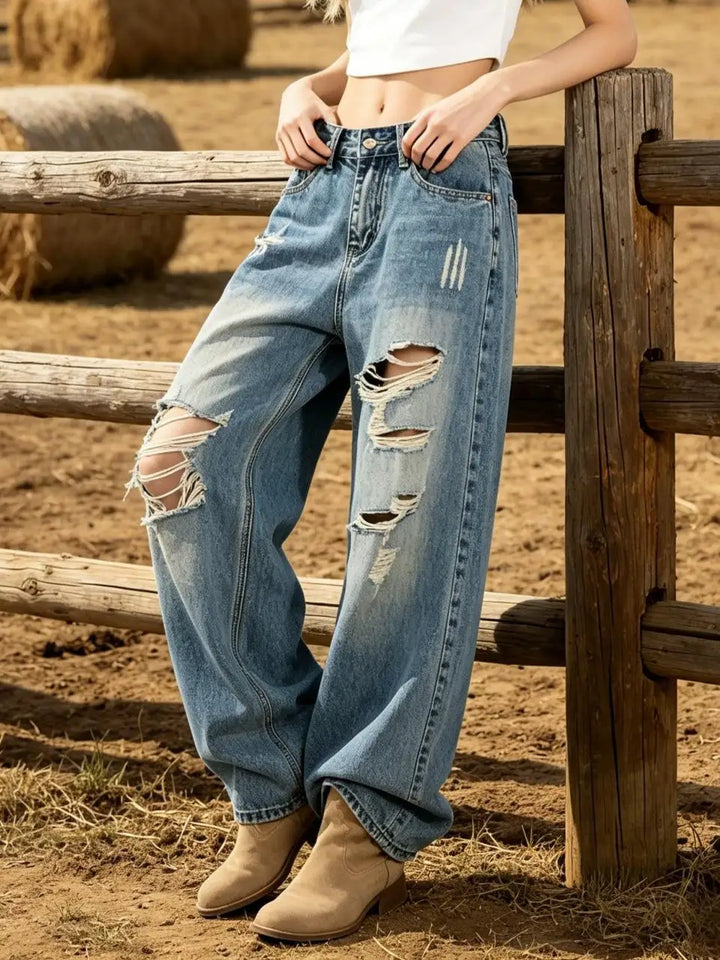 Women’s high-waist light blue relaxed jeans with ripped knees and frayed distressed rips
