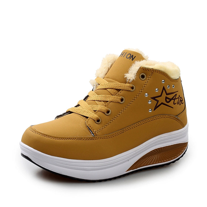 Tan high-top sneaker with white sole on a white background