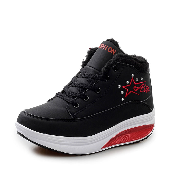 Black high-top sneaker with red accents on a white background
