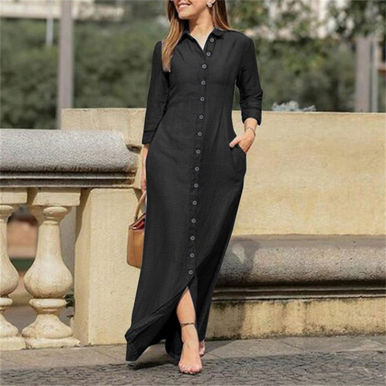 Black long-sleeve denim button-up dress with pointed collar and button placket