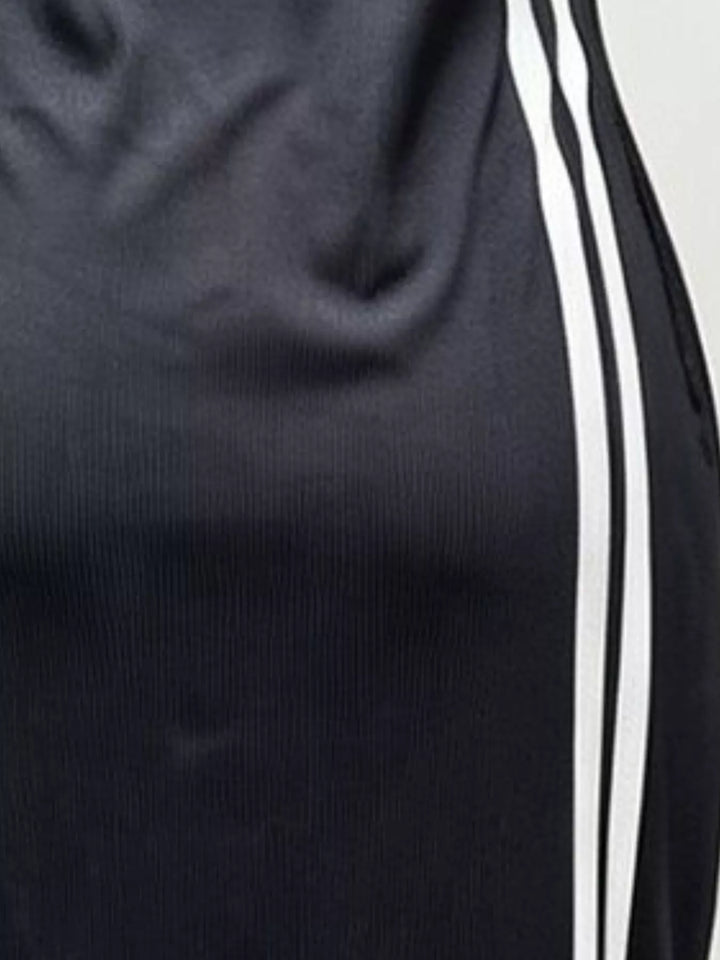 Dark fabric midi dress with bold white vertical stripes (close-up)