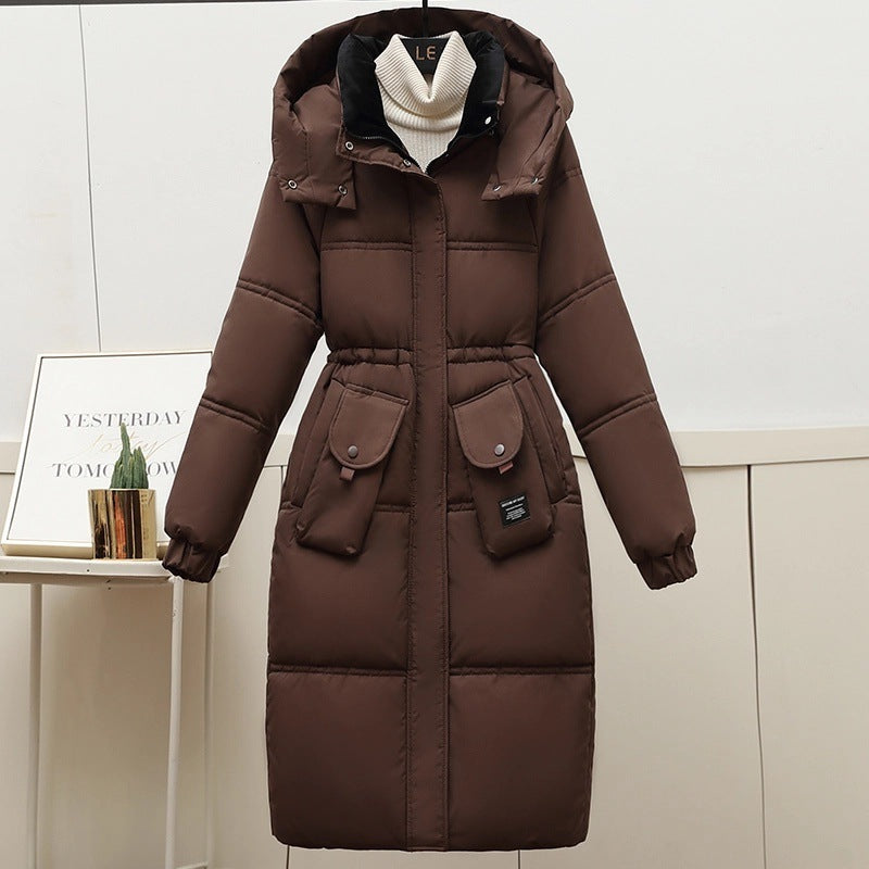 Brown Women's Plus Size Long Hooded Puffer Coat Styled Over A Cream Turtleneck