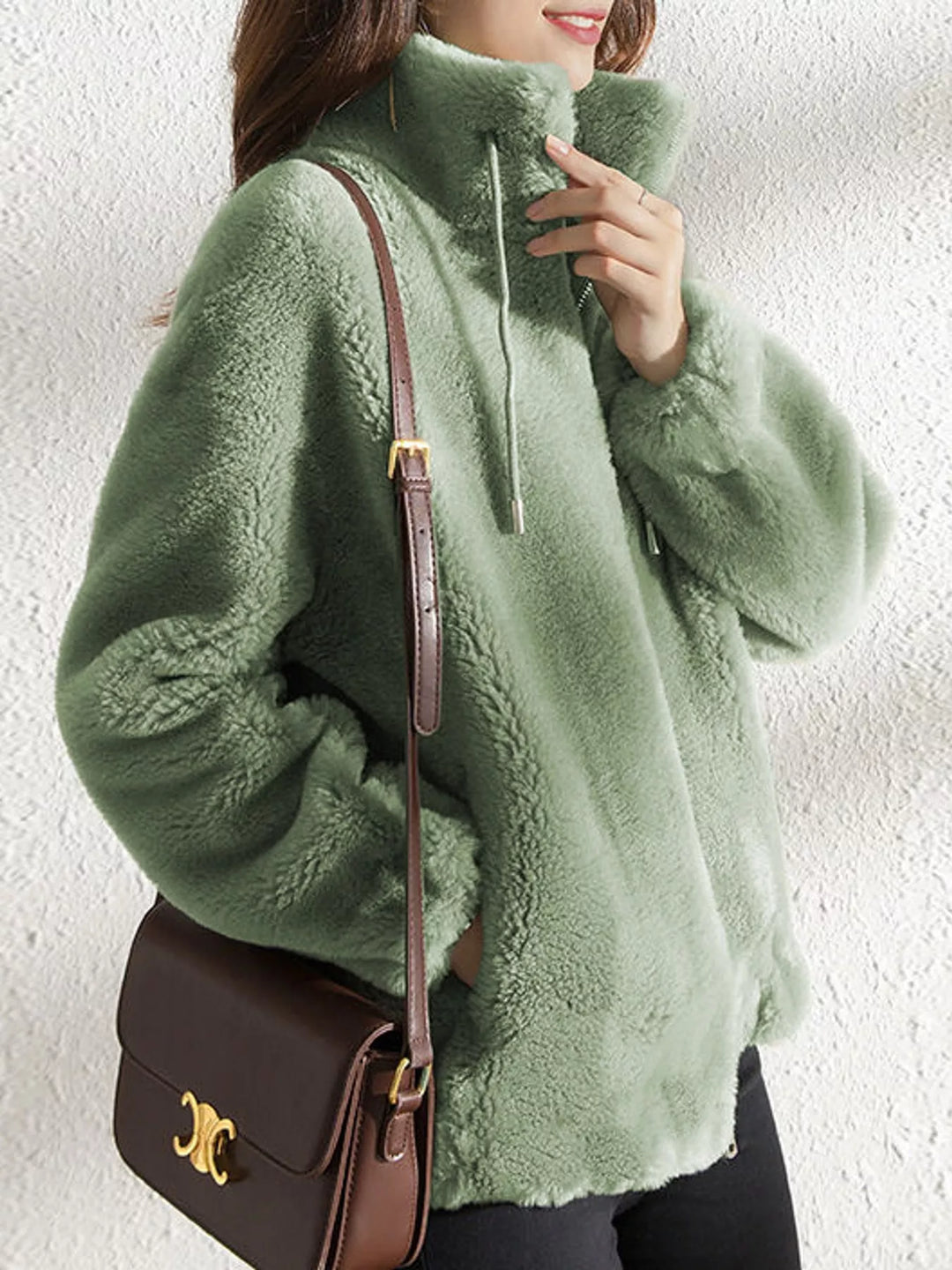 Green faux fur stand-collar zip jacket with drawstring ties, front view